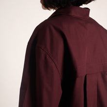 Load image into Gallery viewer, Back view of model wears pleated yoke shirt, made with Oxford Cotton fabric
