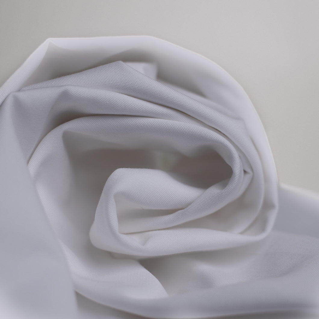 Oxford Cotton Fabric sheet folded in a roll, shown at the end