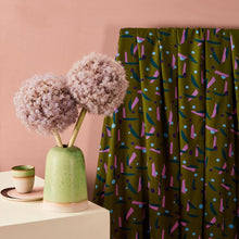 Load image into Gallery viewer, Viscose fabric with bold shapes pattern hangs by a table with a vase
