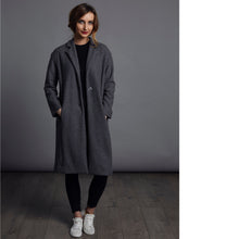 Load image into Gallery viewer, Lady wears a wool coat with hands in pocket opened
