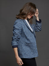 Load image into Gallery viewer, Side view of lady wearing blazer with sleeves folded up and ruched up on arm
