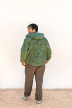 Load image into Gallery viewer, Back view of model wearing hooded Beachcomber jacket
