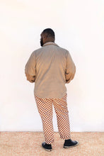 Load image into Gallery viewer, Back view of model wearing collared Beachcomber jacket
