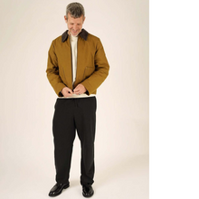 Load image into Gallery viewer, Model wears a jacket, fastening the zipper
