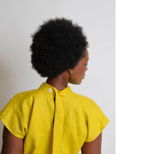 Load image into Gallery viewer, Back view of lady wearing the zero waste top, short sleeve with tie at neck
