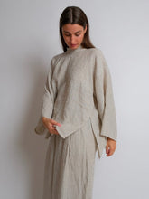 Load image into Gallery viewer, Lady wears the Zero Waste Tie Top, long sleeve with side split seam
