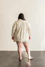 Load image into Gallery viewer, Back view of lady wearing long sleeved Butano button Up Shirt
