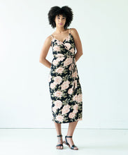 Load image into Gallery viewer, Lady wears the Calvin wrap dress with waist tie in floral print fabric
