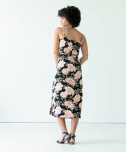 Load image into Gallery viewer, Back view of lady wearing the Calvin wrap dress with waist tie in floral print fabric
