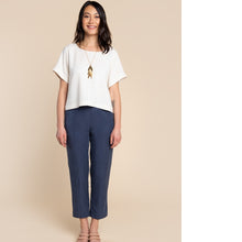 Load image into Gallery viewer, Lady stands wearing a boxy Cielo top
