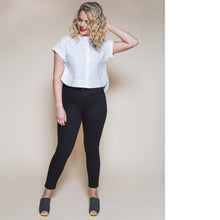 Load image into Gallery viewer, Lady wears a cropped collarless Kalle Shirt with rounded hems
