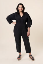 Load image into Gallery viewer, Lady wears a Jo Jumpsuit with croissant style sleeves
