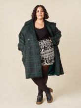 Load image into Gallery viewer, Model wears the Phoebe Coat, an double breasted coat with oversized patch pockets, worn open
