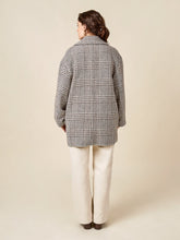 Load image into Gallery viewer, Back view of model wearing mid-thigh length overcoat
