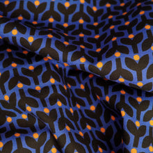 Load image into Gallery viewer, Organic cotton fabric crumpled up, with print of stems and dots in tessellating pattern
