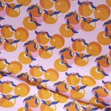 Load image into Gallery viewer, Organic cotton fabric with print of Clementines, displayed with a soft fold
