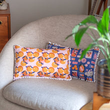 Load image into Gallery viewer, Cushion on a sofa, made with the Clementine Dream Organic Cotton Fabric
