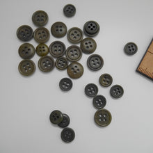 Load image into Gallery viewer, Scattering of 4-hole corozo buttons in two different sizes
