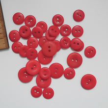 Load image into Gallery viewer, Scatter of 2-hole corozo buttons in two different sizes
