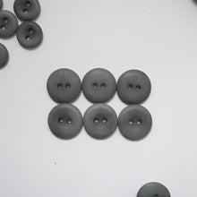 Load image into Gallery viewer, Larger size 2-hole corozo buttons shows a smooth side, and a concave side
