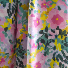 Load image into Gallery viewer, EcoVero viscose fabric with painted flowers print hangs in drape
