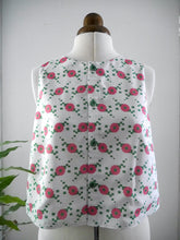 Load image into Gallery viewer, A sleeveless vest with digital floral pattern, displayed on a mannequin .
