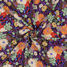 Load image into Gallery viewer, Eco Viscose fabric with a vibrant floral print displayed with central swirl to show drape
