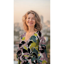 Load image into Gallery viewer, Model wears a V-neck dress, made up in Eco Viscose Fabric with large-scale floral pattern
