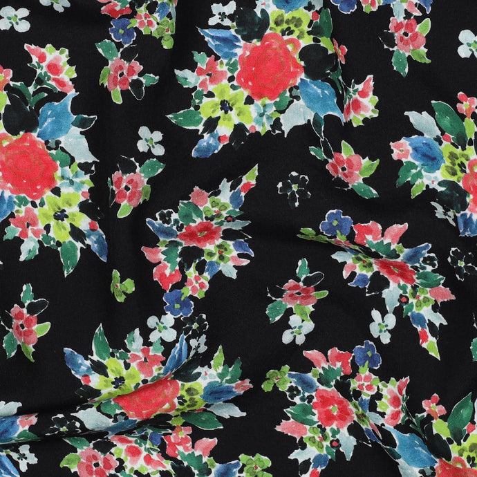 Eco Viscose Fabric shown close up print of flowers with a hand-drawn, felt-tip pens look