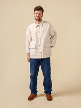 Load image into Gallery viewer, Model wears a Fowler Barn Coat; worn fastened with large patch pocket details
