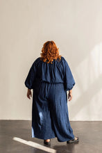 Load image into Gallery viewer, Back view of lady wearing Avenir Jumpsuit with long sleeves
