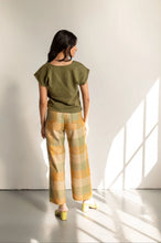Load image into Gallery viewer, Back view of model wearing wide-leg trousers with patch pockets
