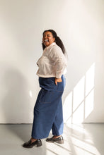 Load image into Gallery viewer, Side view of model wearing wide leg trousers with patch pocket at side and back
