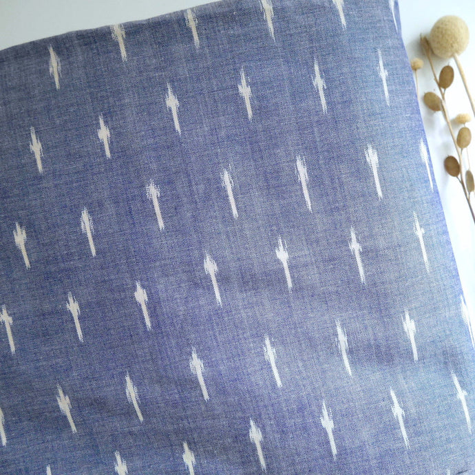 Folded piece of Ikat Cotton Fabric with Spots pattern