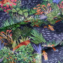 Load image into Gallery viewer, Cotton lawn fabric shown in soft drapes, with a vibrant print featuring bathers, plants, and flowers in a lake
