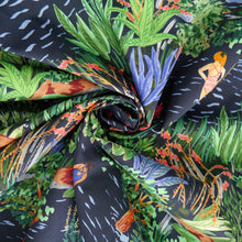 Load image into Gallery viewer, Cotton lawn fabric displayed with central swirl, with a vibrant print featuring bathers, plants, and flowers in a lake
