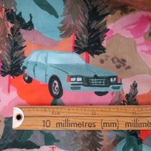 Load image into Gallery viewer, Ruler sits underneath a print of a car on cotton fabric
