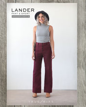 Load image into Gallery viewer, True Bias&#39; Lander Pant Packaging displays lady wearing a high-waisted pair of trousers with visible button fly front and side patch pockets
