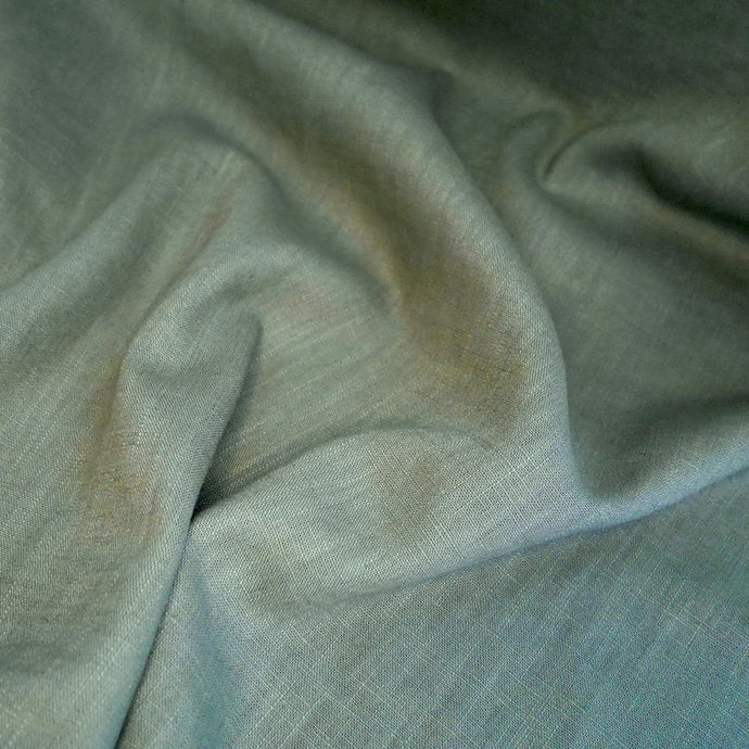 Linen displayed on table with soft folds