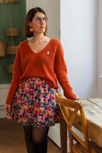 Load image into Gallery viewer, Lady wears a short flared skirt made with Boreale viscose fabric
