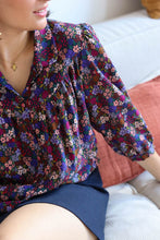 Load image into Gallery viewer, Lady wears a collared blouse made up of Enchanted Floral Viscose Fabric
