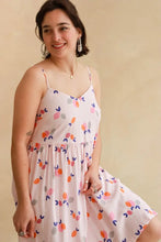 Load image into Gallery viewer, Lady wears a strappy v-neck dress made up in Limonade Viscose fabric
