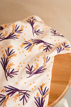 Load image into Gallery viewer, Mimosa Viscose fabric with sprigs print lays on wooden table
