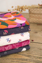 Load image into Gallery viewer, A pile of Lise Tailor fabrics folded with the Fairytale print on the top
