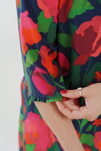 Load image into Gallery viewer, Close-up of a colorful floral dress sleeve, made with La Roseraie Viscose fabric
