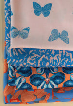 Load image into Gallery viewer, Four different Madame Iris fabrics folded and placed on top on one another
