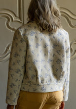 Load image into Gallery viewer, Back view of lady wearing Dandelion Jacket, with back yoke and curved waistband
