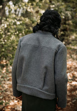 Load image into Gallery viewer, Back view of lady wearing Dandelion Jacket, shows two pleats at the waistband
