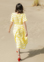 Load image into Gallery viewer, Back view of lady wearing a short-sleeve dress with elasticated waistband for skirt
