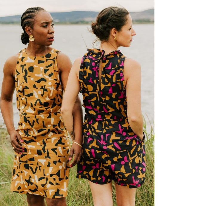 Lady on left wears a Luz Dress, lady on right wears a Luz jumpsuit with ruffles along neck and armholes.